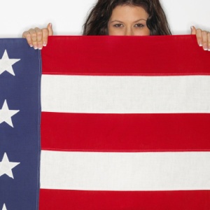 woman covering herself with US flag