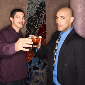 two men drinking in a bar