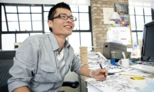 man sitting by the computer